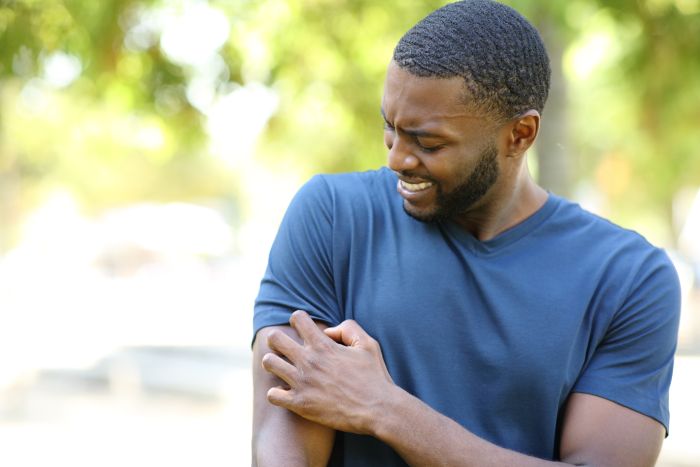 In addition to wearing long sleeves and pants, using DEET spray can help prevent insect bites. (Getty Images)
