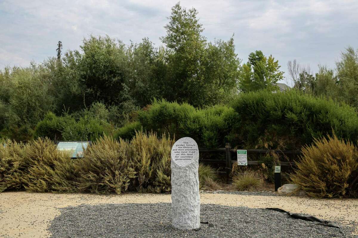 A stone sign dedicated to the Ohlone Tribes, the original inhabitants of the Bay Area, can be seen at Upper Penitencia Creek Contemplative Garden on the Bay Area Ridge Trail in San Jose, Calif., Monday, July 26, 2021. The trail is 550- miles of proposed road that would bypass the nine county area. It is approaching 400 miles of track completed after 30 years of work.
