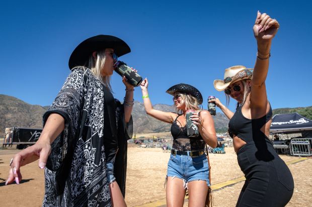 Residents of Yucaipa, from left to right, Christian Kruger, Mandy Villarreal and Laura...