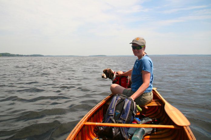 Jenn McCallum with her dog Blitz on Rice Lake on June 6, 2021, on a paddle trip a group of 16 friends from Peterborough took the Trent-Severn Waterway from the Otonabee River in South Peterborough to the Bay of Quinte. (Photo: Taylor Wilkes)